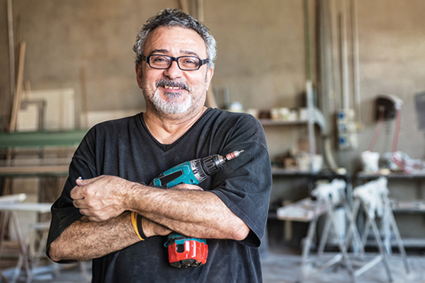 Employment Opportunities Seniors101.ca - man holding drill on worksite